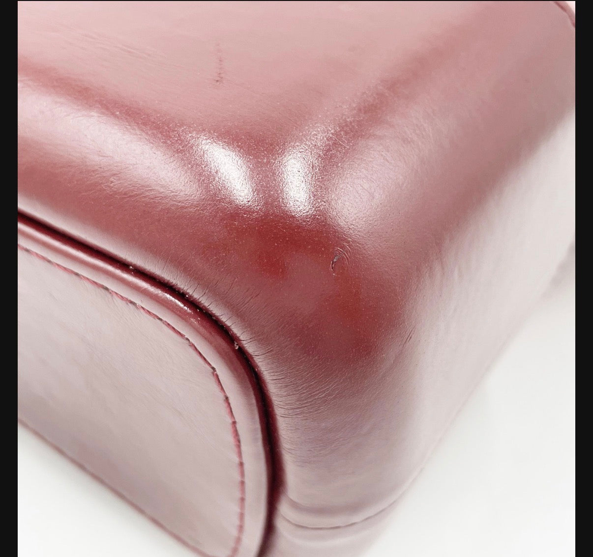 Chanel Gabrielle opposite leather lower corner with visible wear